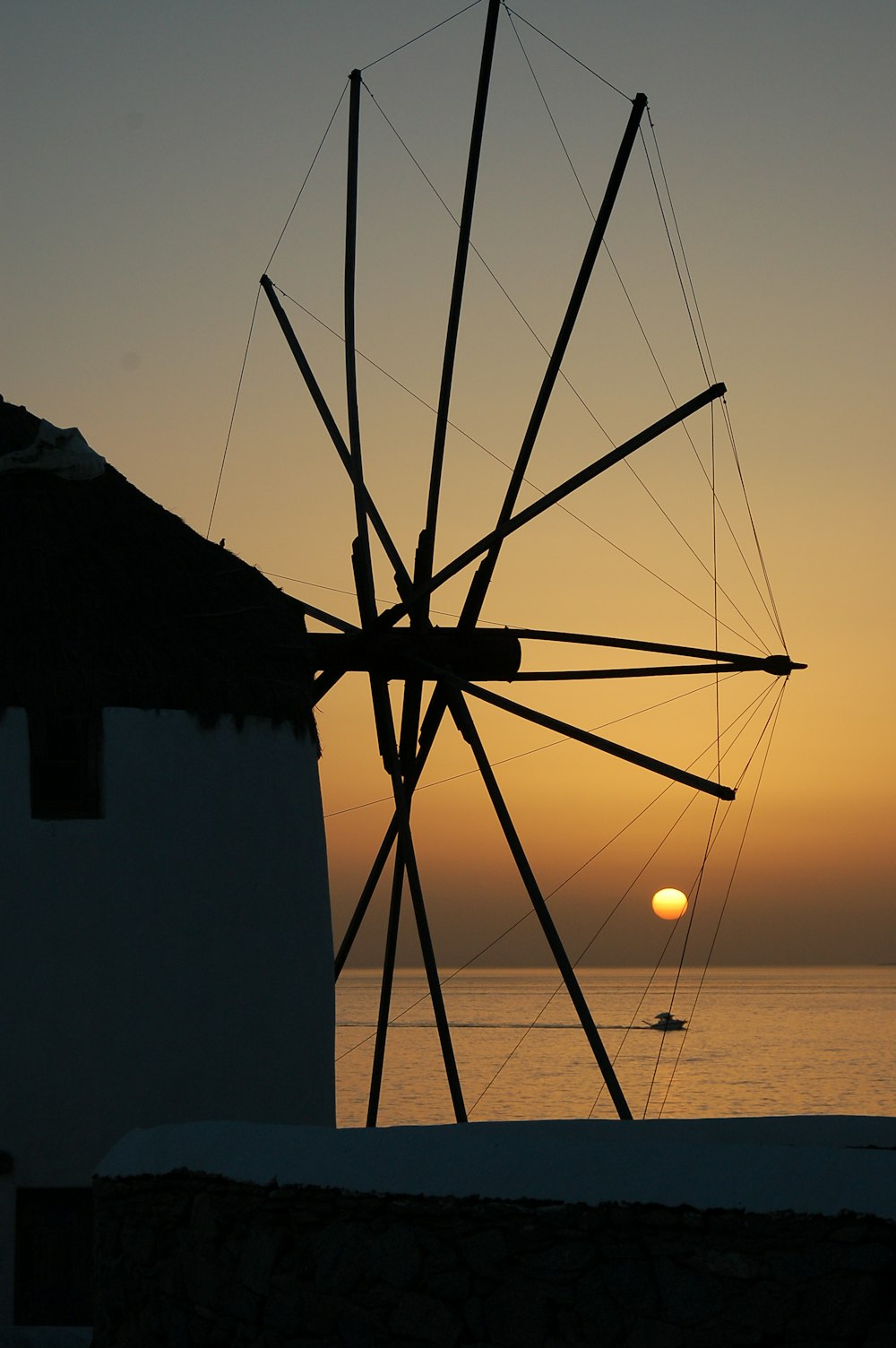 silhouette of boat on body of water