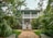 white house with outdoor fountain