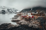 red and grey houses near river during daytime