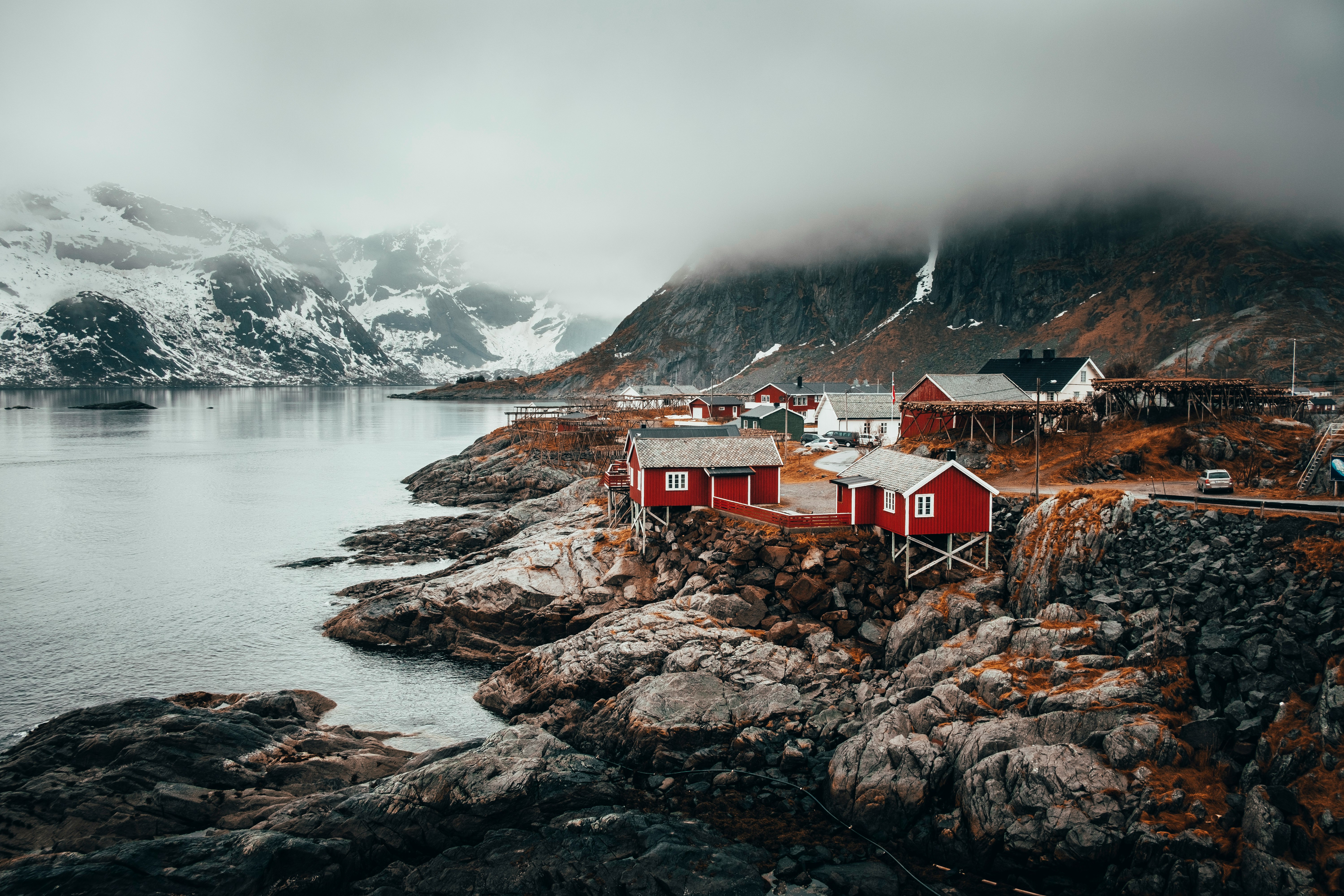 red and grey houses near river during daytime