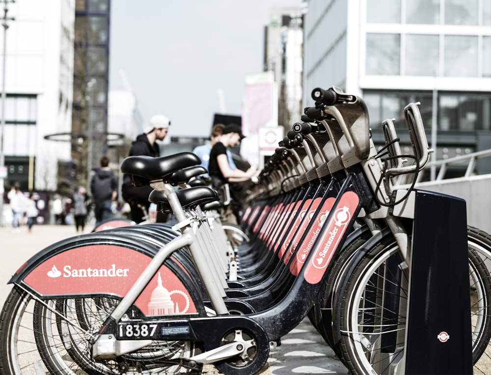 black Santander bicycles parked on bicycle stand