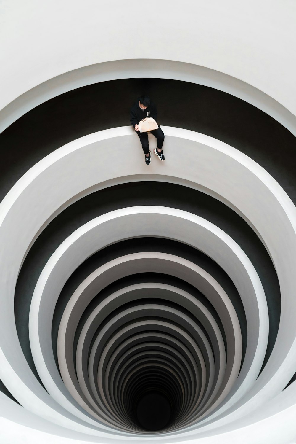 man sitting on deep pit design