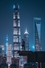 man standing on top of skyscraper