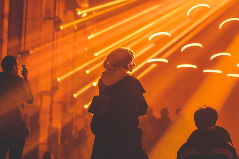 person standing being shined by light