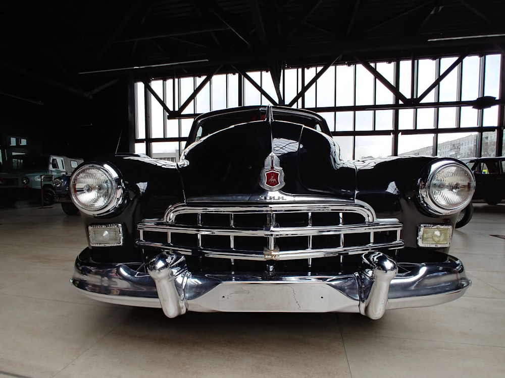 vintage black car parked at the garage