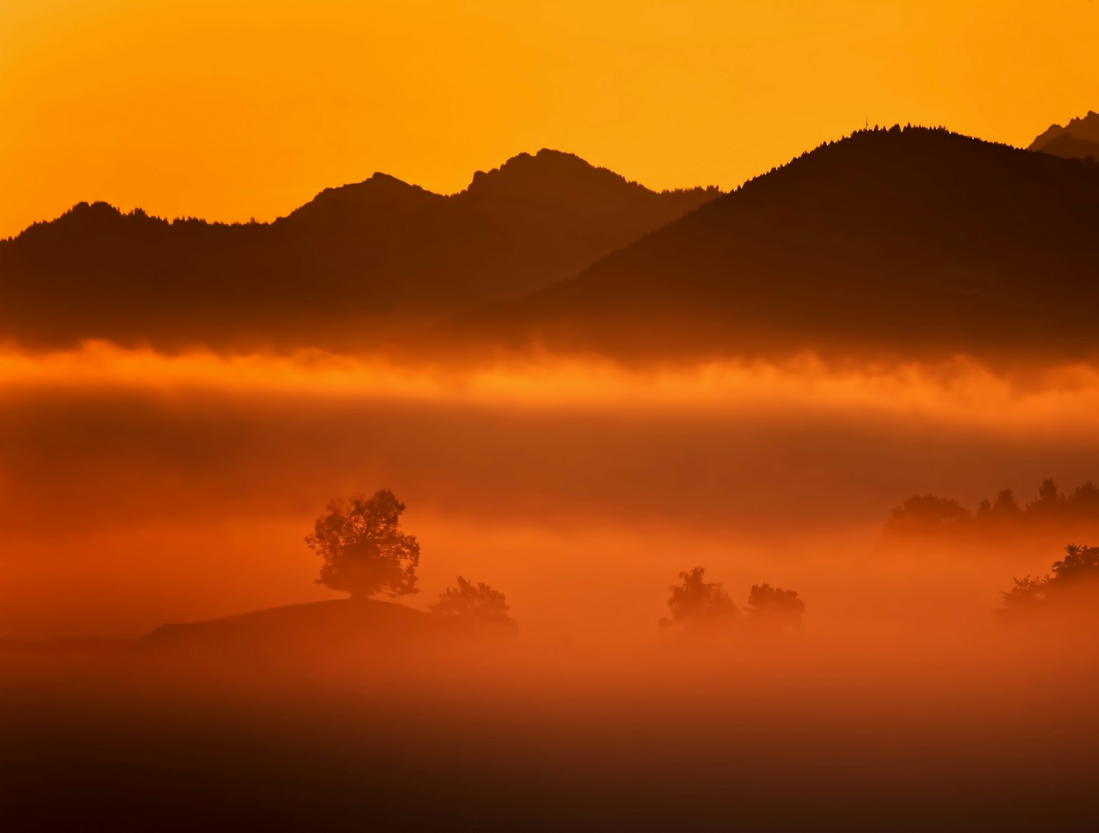 Canon EOS 5D Mark II + Canon EF 70-300mm F4.5-5.6 DO IS USM sample photo. Silhouette of mountain covered photography