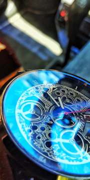 Close-up of resin clock face with swirling blue and gold patterns