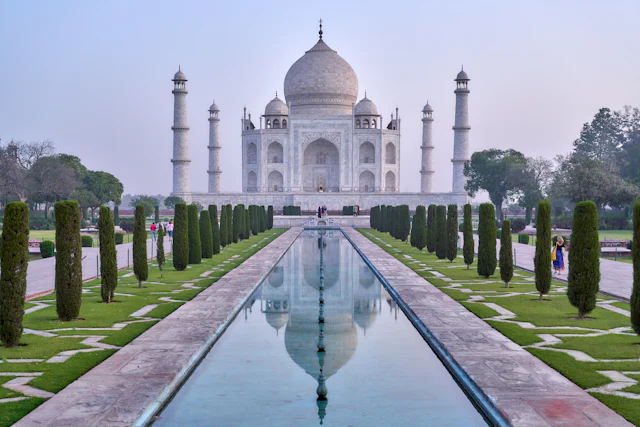 The Taj Mahal at the end of its reflecting pool, framed by clipped garden hedges