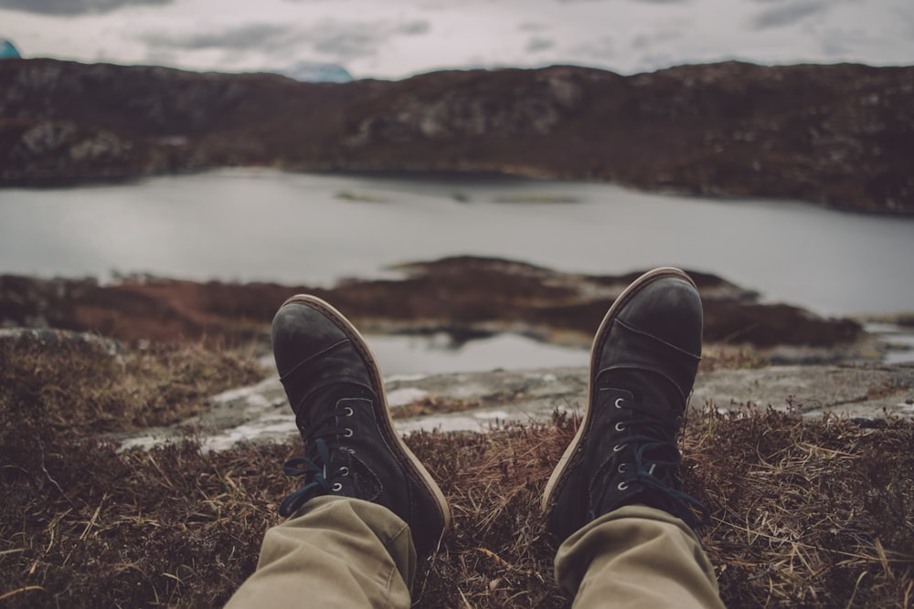 person's perception of body of water and mountain