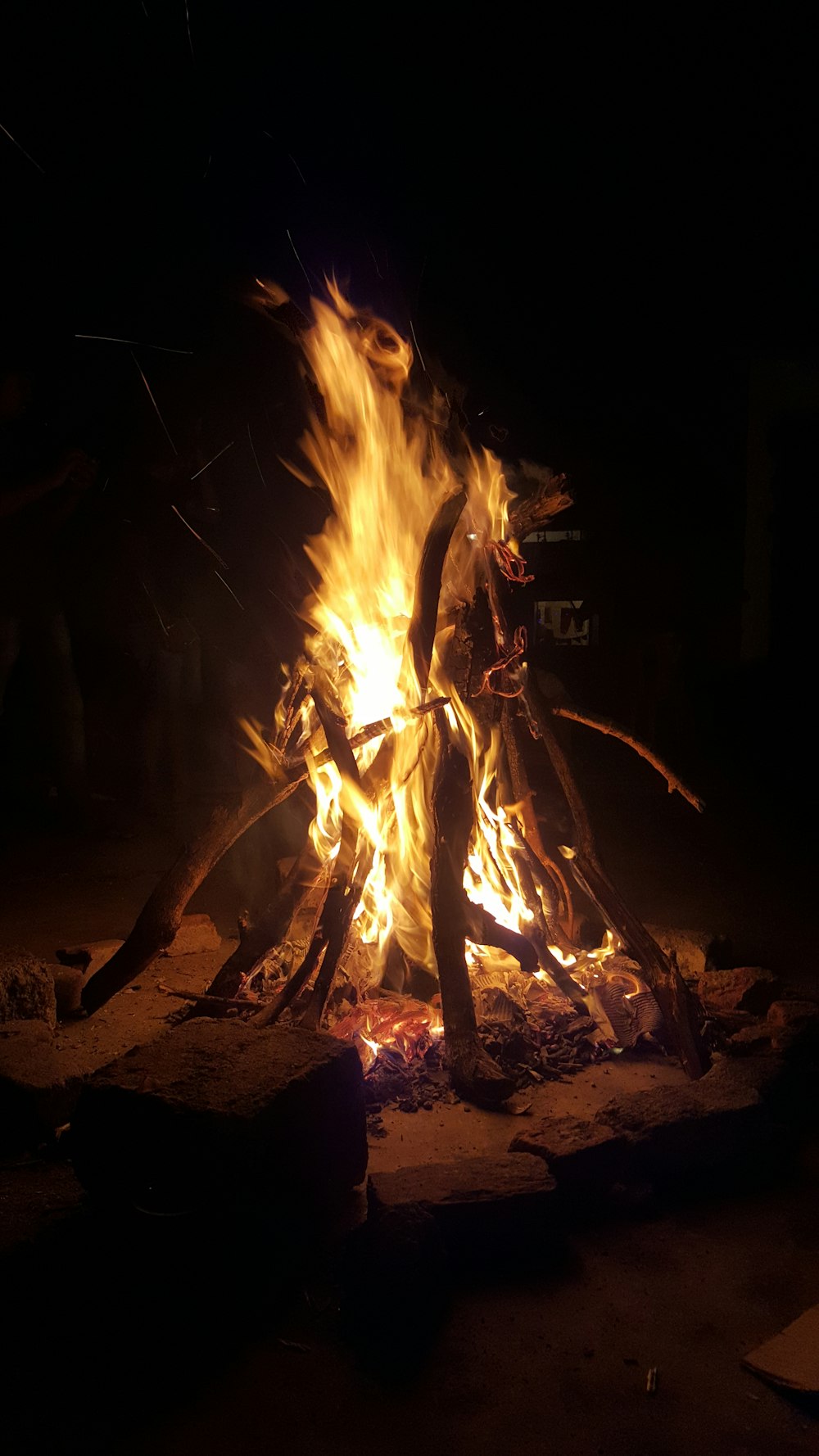 person standing near bonfire