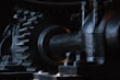 close-up photography of black metal gears