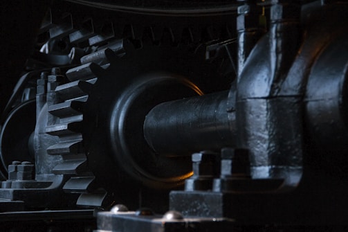 close-up photography of black metal gears