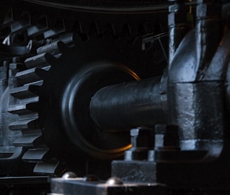 close-up photography of black metal gears