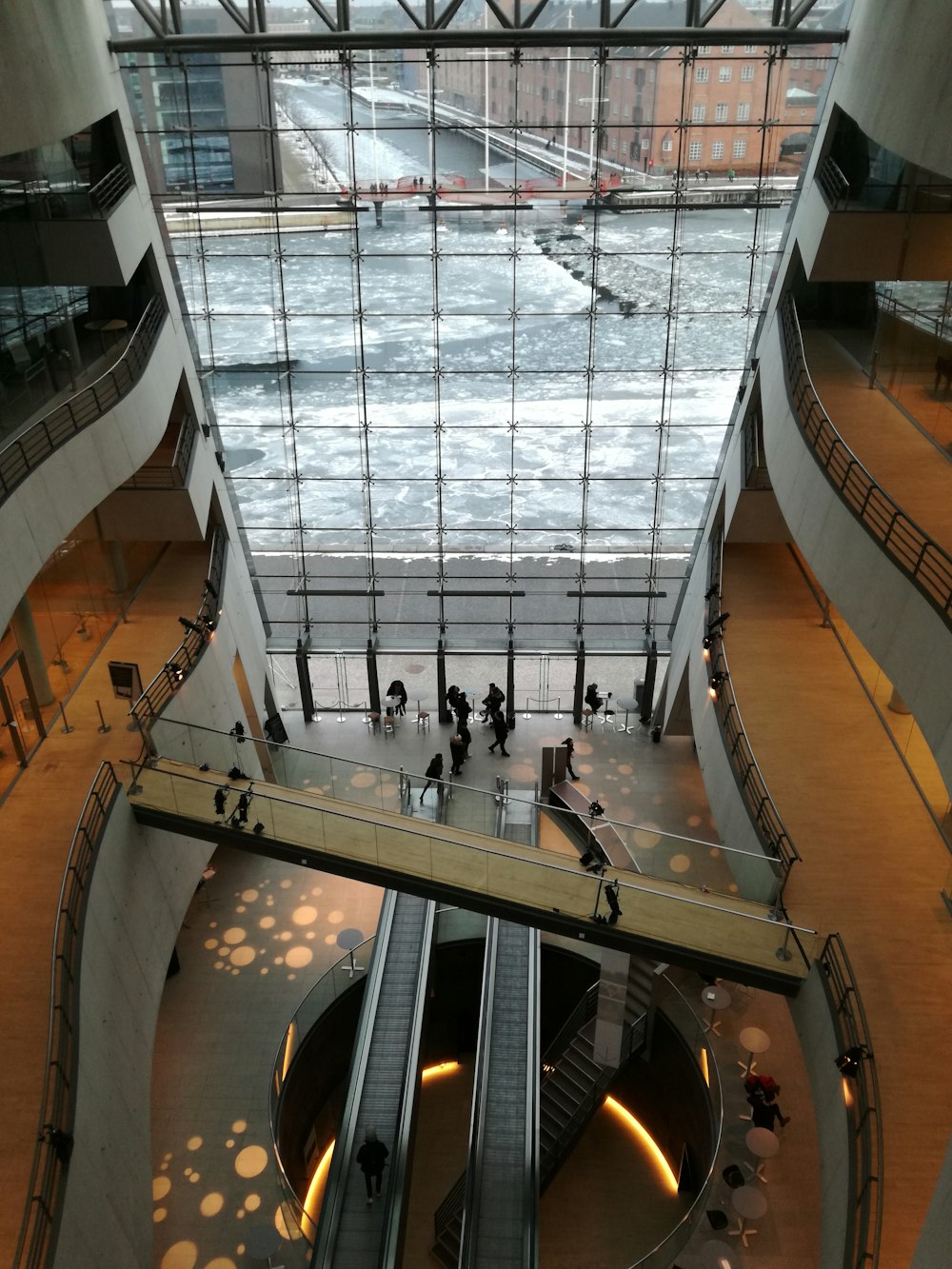 high-angle photo of people inside glass building