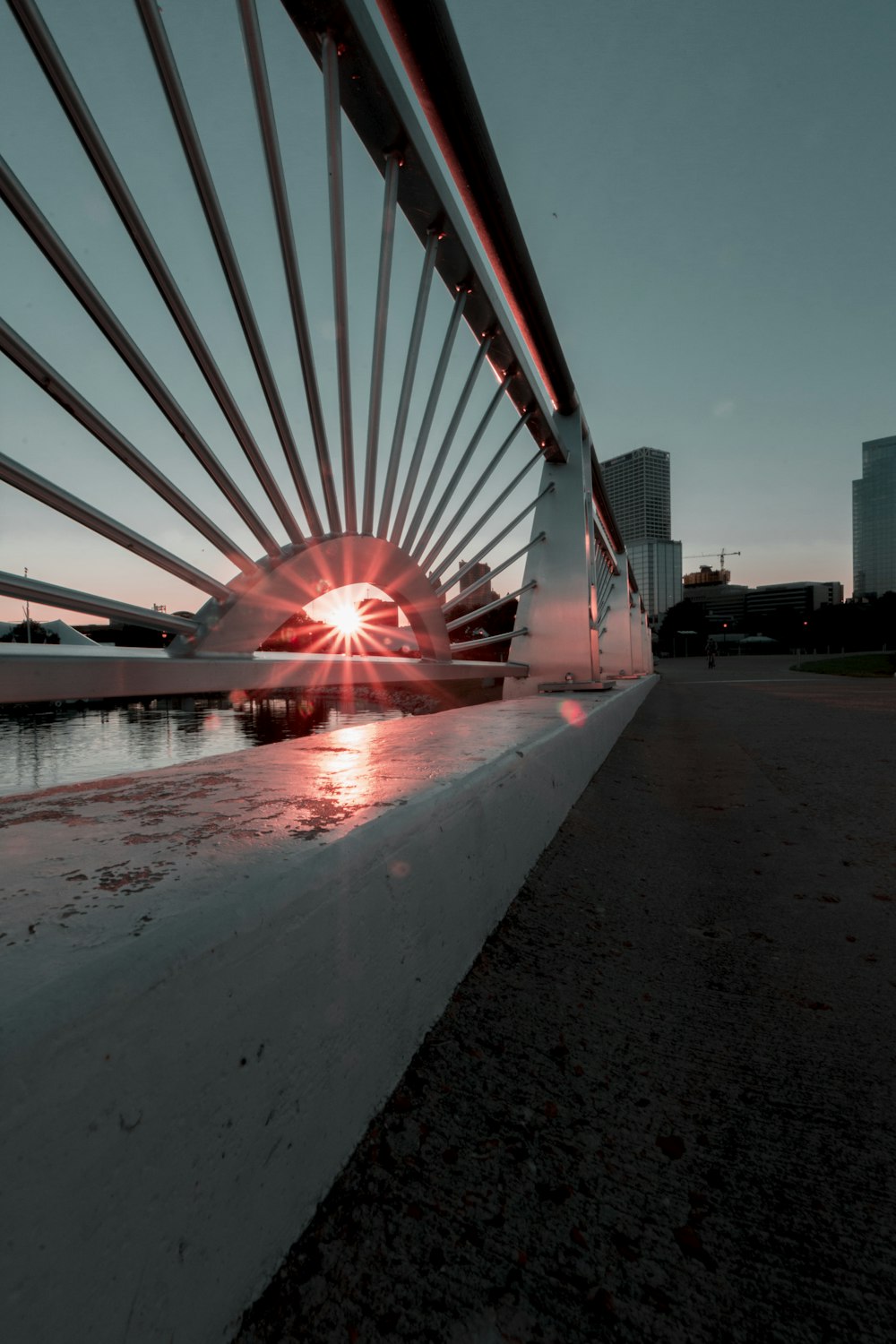 white and red concrete building near body of water during night time