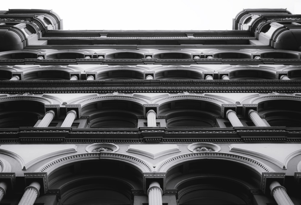 low angle view of baroque building in grayscale photo