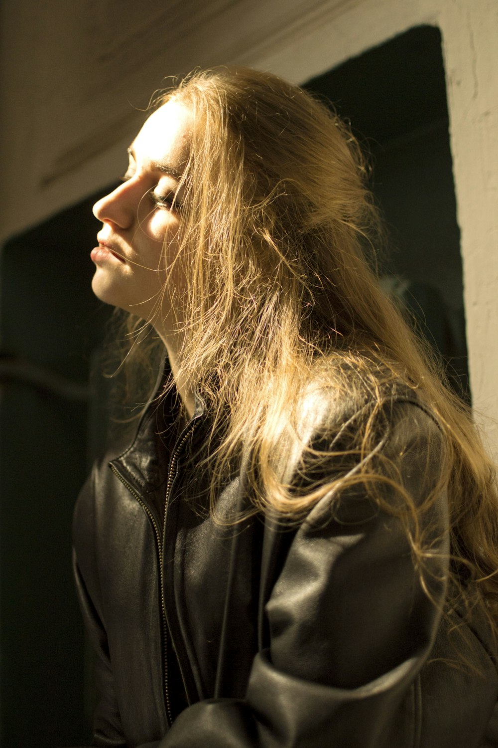 woman wearing black leather zip-up jacket