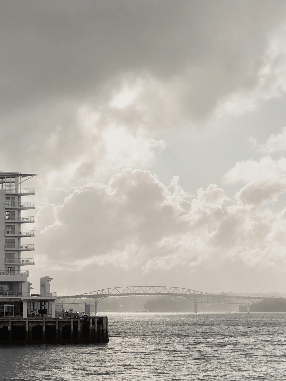 white bridge on the top of body of water during daytime