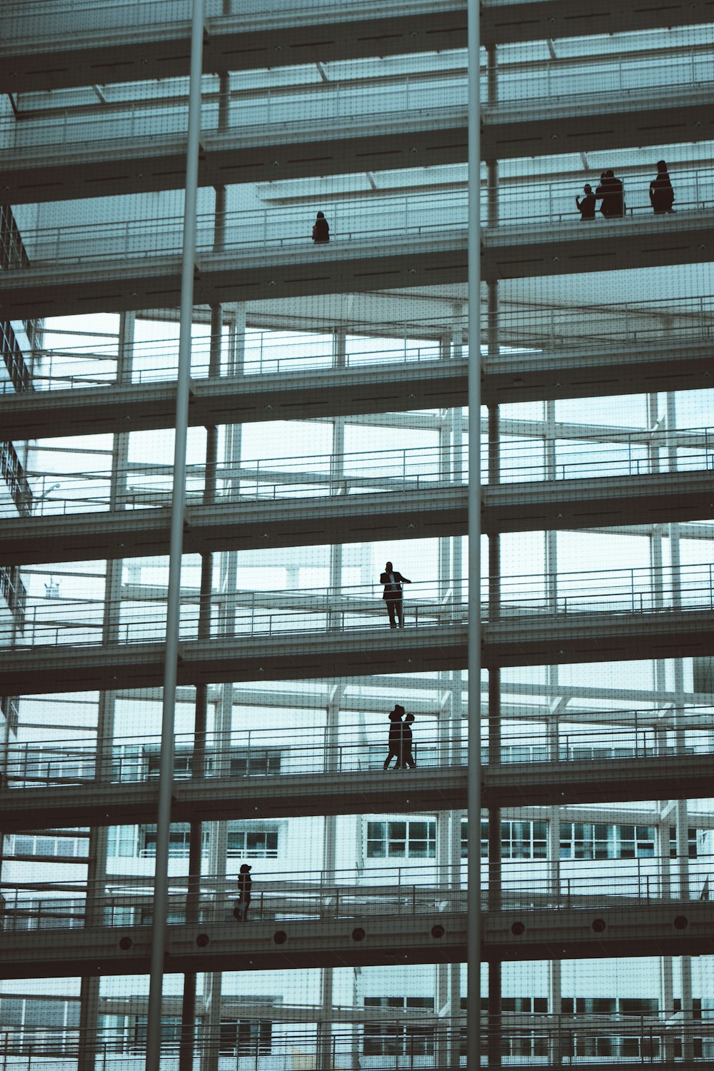 low-angle photography of people on building