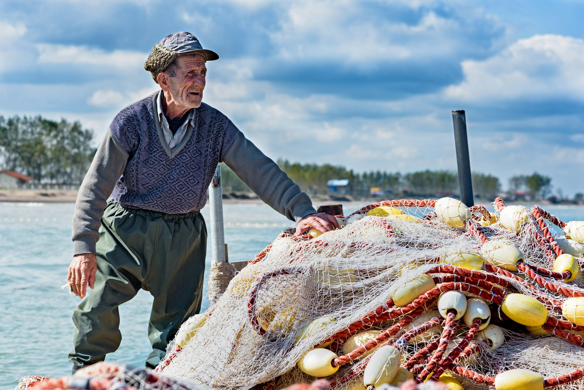 man holding fishing net