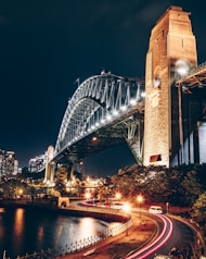 black and brown concrete bridge during night time