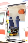 opened white and orange travel trailer