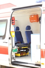 opened white and orange travel trailer