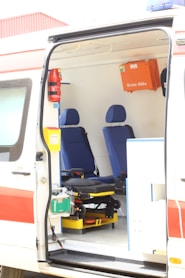 opened white and orange travel trailer