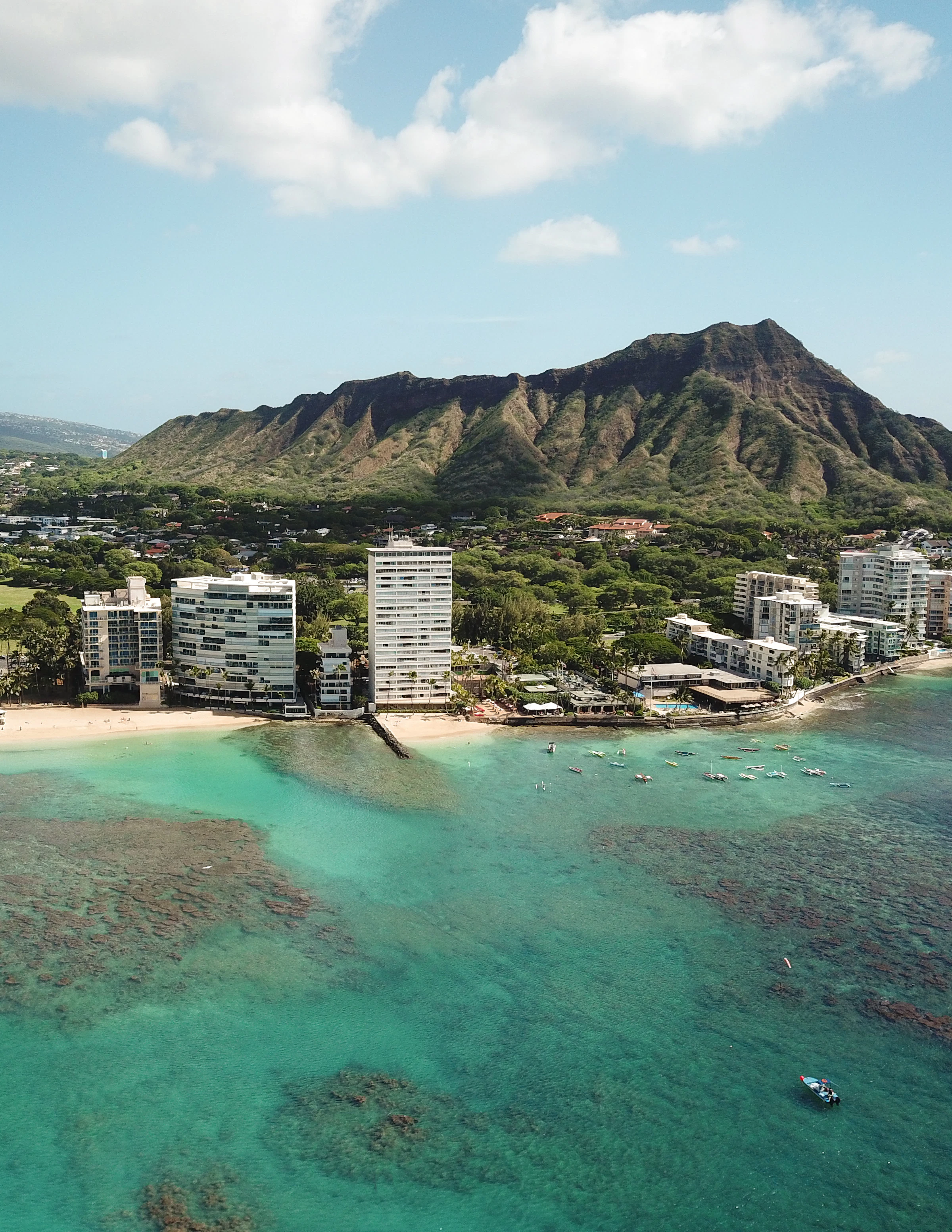 Diamond Head crater rising behind the buildings of Honolulu, O'ahu