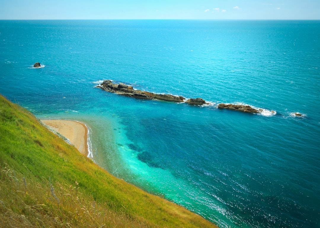 aerial view of breakwater under clear skies