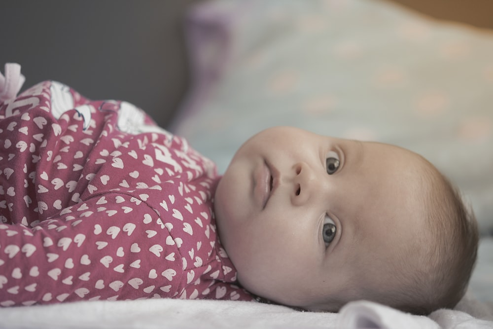 baby lying on bed