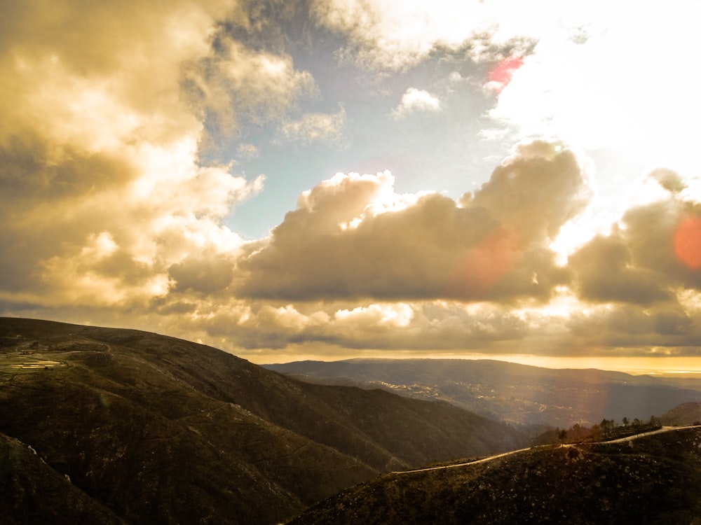 green mountains under daytime sky