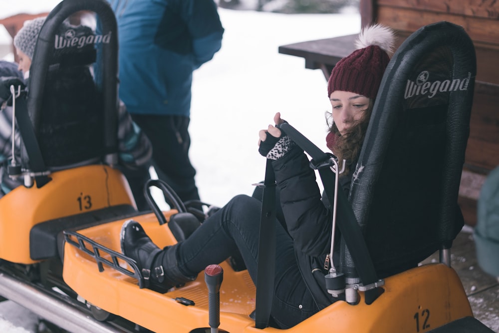 woman seating on amusement park ride