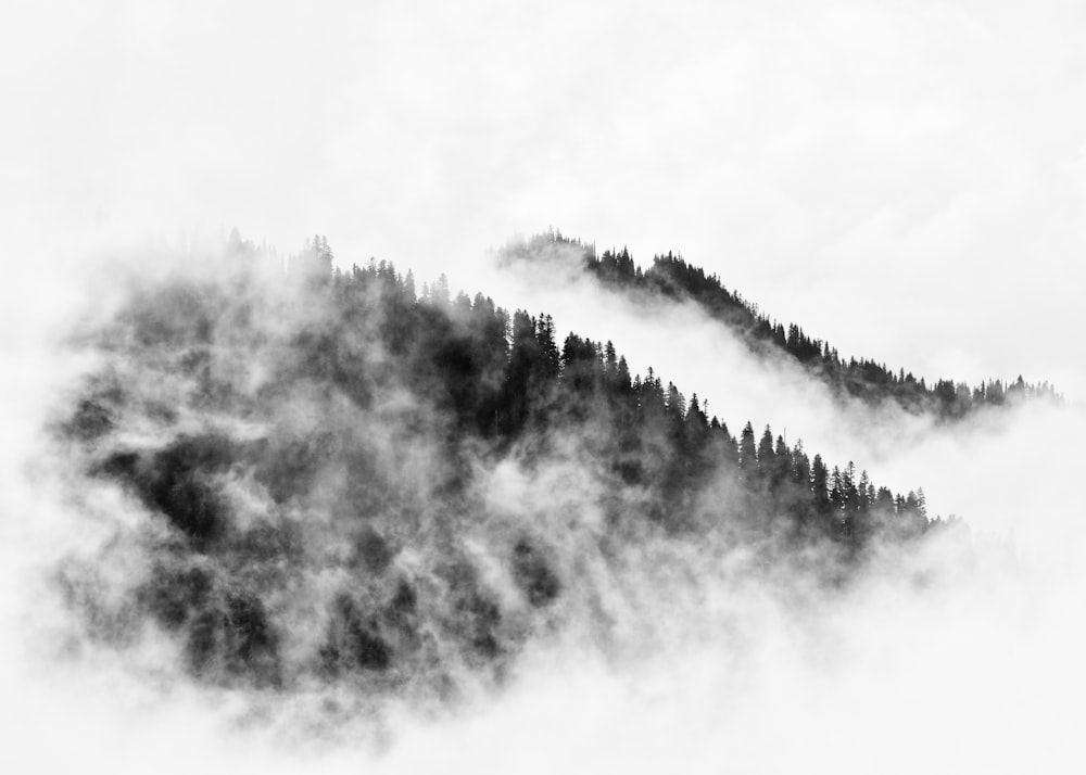 aerial view of fog covered mountain ranges