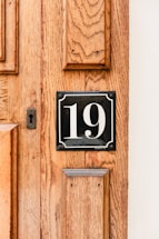 A locksmith opening a door at night in Rome with a phone number visible.