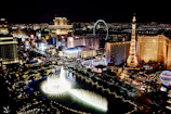 A scenic view of a famous landmark illuminated at night during an international tour.