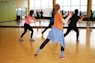 women dancing near mirror