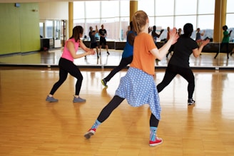 women dancing near mirror