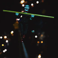 The Fucking Magician performing eerie tricks under flickering carnival lights.