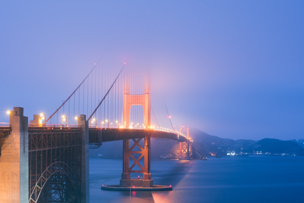 gray suspension bridge near body of water