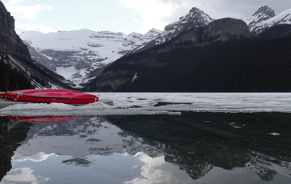 red boat on body of water