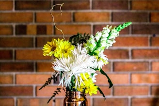 yellow and white flower on vase