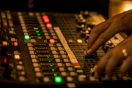 Musician adjusting sound levels on a digital audio workstation