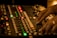 Close-up of a sound engineer adjusting audio levels in a professional studio.