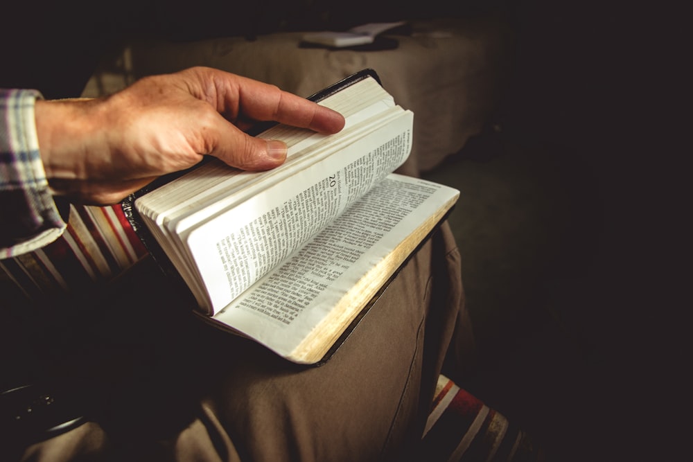 person holding book