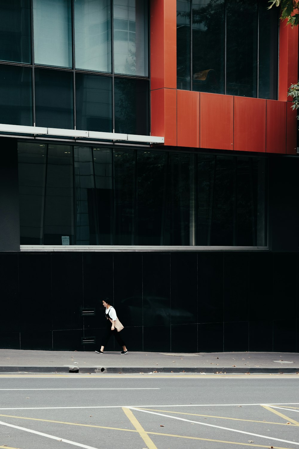 woman talking beside building