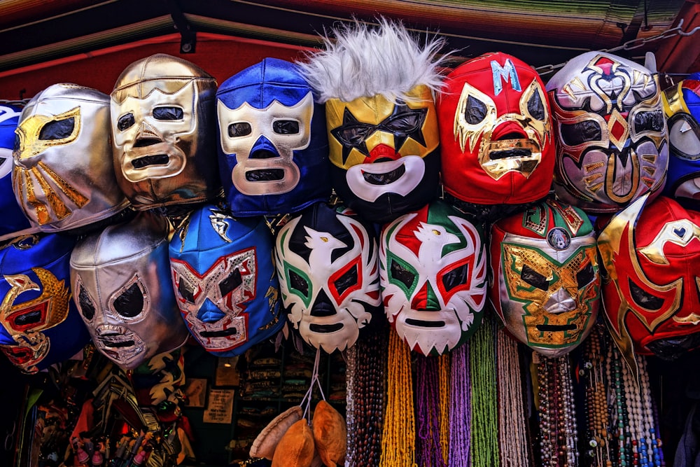 assorted-color of masks hanged on rod