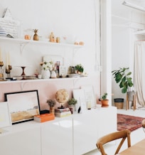 white wooden shelf and decors