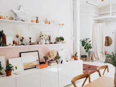 white wooden shelf and decors