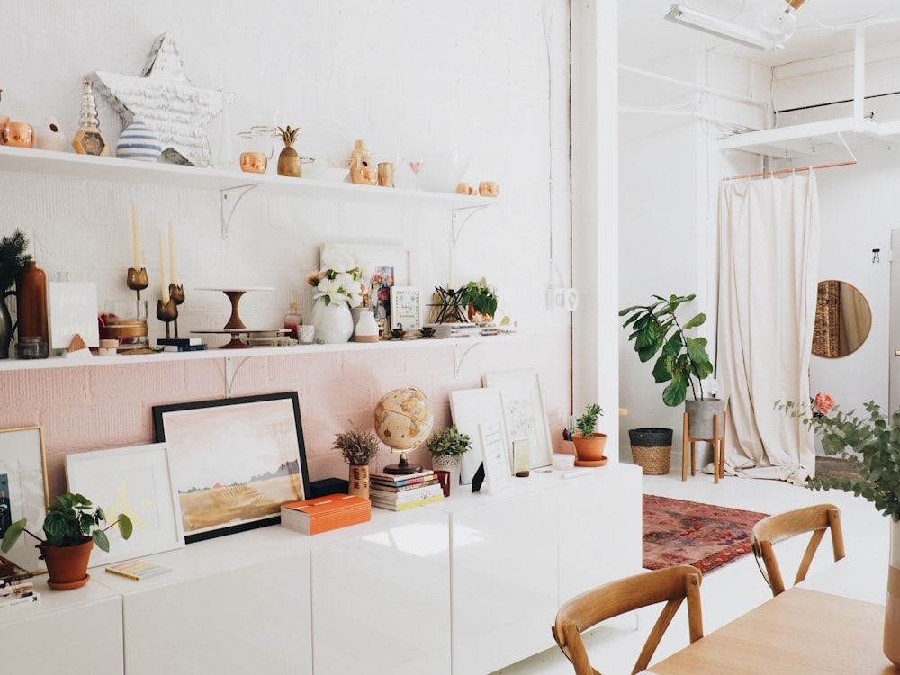 white wooden shelf and decors